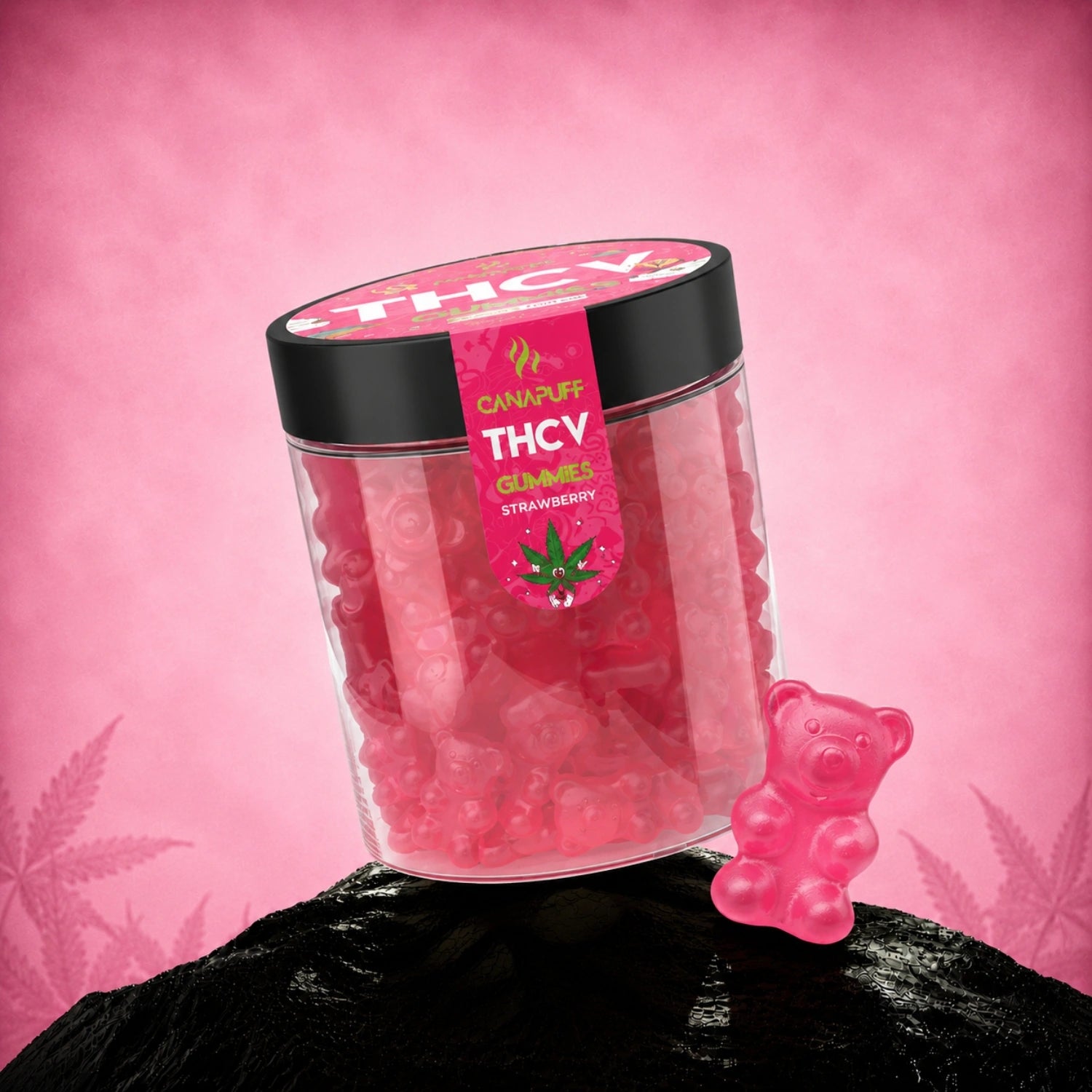 Canapuff THCv gummies strawberry flavor in clear jar with black lid and pink label against pink background
